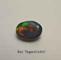 Bild 2 von 0.99 ct.  Schwarzer facett. oval 9 x 6.5 mm Multi-Color Äthiopien Opal