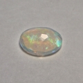 Bild 2 von 1.22 ct. Weißer facett. ovaler 11.2 x  9 mm Multi-Color Äthiopien Opal