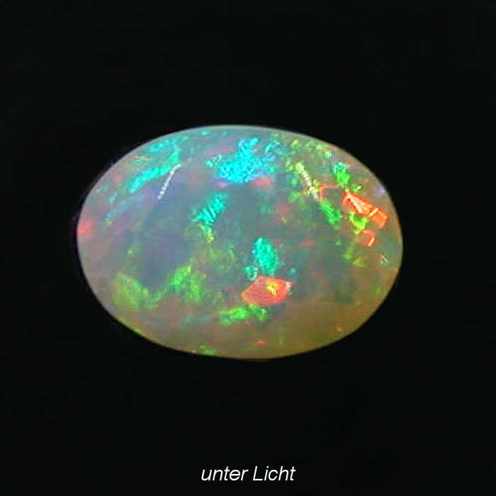 Bild 1 von 1.12ct.! Oval untreated faceted 9 x 7.1 mm Multi-Color Ethiopia Opal