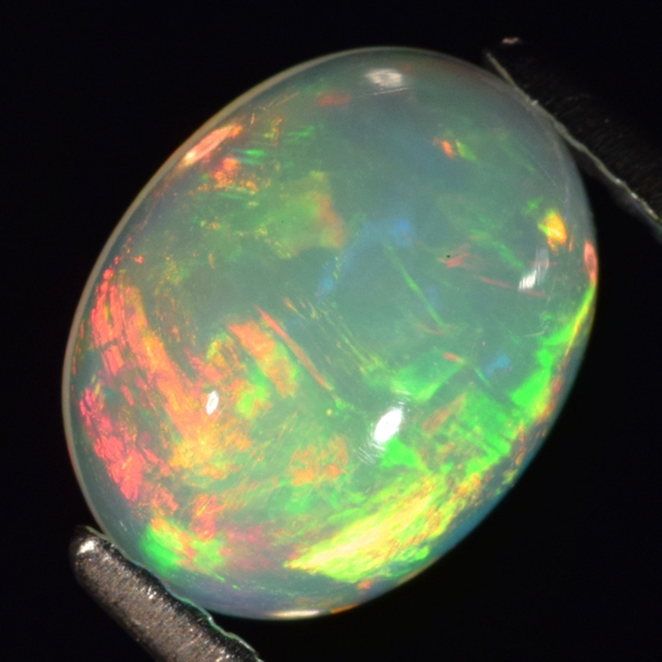 Bild 1 von 1.31 ct.! Fantastic untreated oval 9.2 x 7 mm Multi-Color Welo Opal