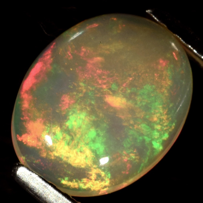 Bild 1 von 1.38 ct. White oval 10 x 8 mm Ethiopia Multicolor Opal