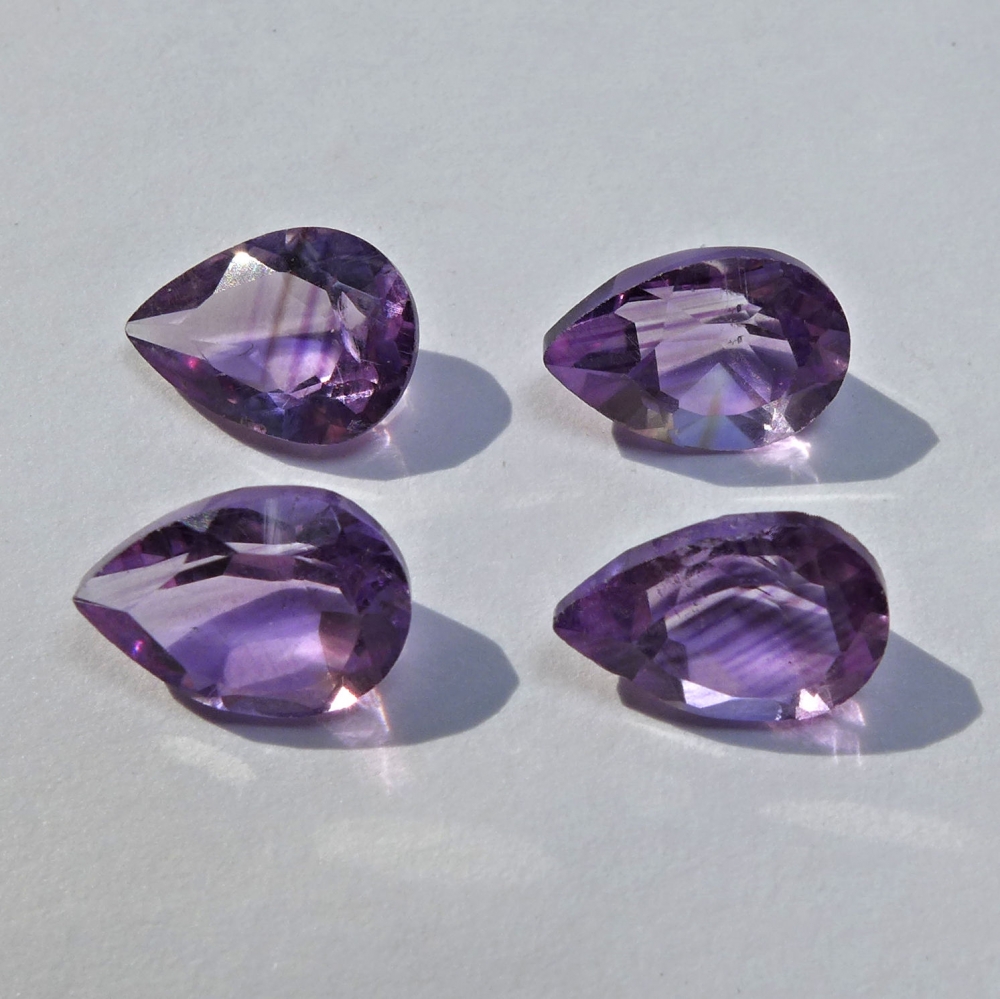 Bild 1 von 7.25 ct. 4 pieces fine 9 x 7 mm Bolivia Amethyst Pears