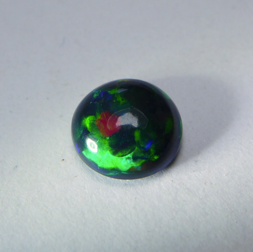 Bild 1 von 1.00 ct. Black round 8 mm Ethiopian Multi Color Opal
