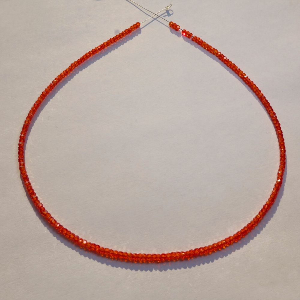 Bild 1 von Orange red Saphire string 70 ct with circular disks Ø 3 mm 40 cm length
