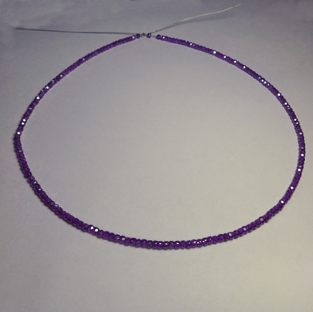 Bild 1 von Blue violet Saphire string 72 ct with circular disks Ø 3 mm 42 cm length
