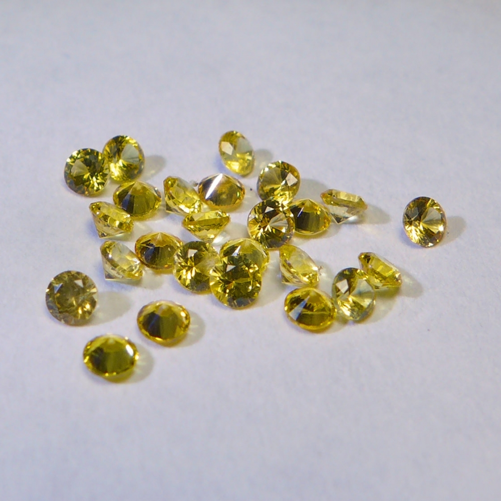 Bild 1 von 1.25 ct. 25 Stück gelbe  runde 2.1 mm Brillantschliff  Padparatscha Saphire