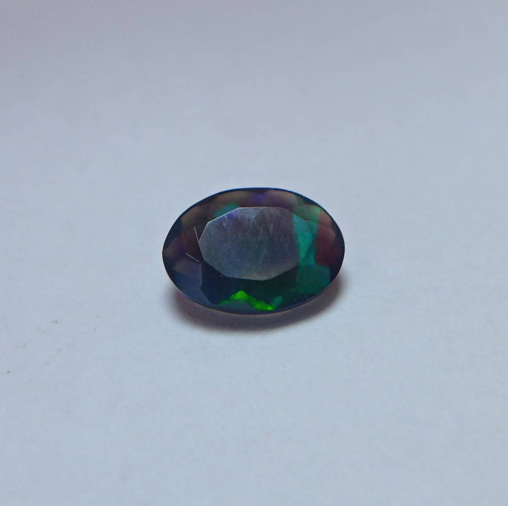 Bild 1 von 1.35 ct. Amazing faceted oval 10.2 x 7.4 mm Multi-Color Ethiopia Opal