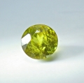 Bild 1 von 1.44 ct.  Feiner runder gelblich grüner 6.3 mm Titanit Sphen