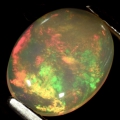 1.38 ct. White oval 10 x 8 mm Ethiopia Multicolor Opal