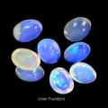 Bild 2 von 4.44 ct. 8 Stück weiße  ovale 7 x 5 mm Multi-Color Äthiopien Opal Cabochons