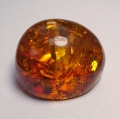 Bild 1 von 60.80 ct. Honiggelber ovaler 33 x 29 mm Ostsee Bernstein 