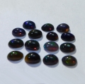 Bild 1 von 2 ct. 15  pieces of  black oval 4.5 x 2.8 mm Multi Color Opals