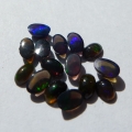 Bild 2 von 2 ct. 15  pieces of  black oval 4.5 x 2.8 mm Multi Color Opals