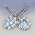 Feines Paar 925 Silber Ohrstecker mit 9 x 7 mm Sky Blue Topas Edelsteinen