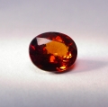 Bild 1 von 1.71 ct. Orangeroter ovaler 7.7 x 6.7 mm Spessartin Granat