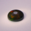 2.25 ct. Black oval 11 x 9 mm Ethiopian Multi Color Opal