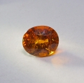 Bild 1 von 2.5 ct. Toller orange-roter ovaler 8.3 x 7 mm Spessartin Granat