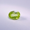 Bild 1 von 0.91 ct.  Feiner ovaler gelblich grüner 7 x 5 mm Titanit Sphen