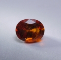 1.4 ct. Zarter orange-roter ovaler 7 x 5.7 mm Spessartin Granat
